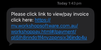 A cropped screenshot of an SMS message with an Invoice payment link for Workshop Software.