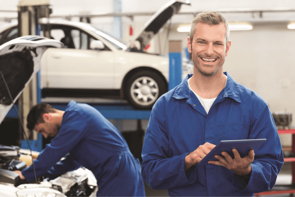 Wworking mechanic and smiling mechanic