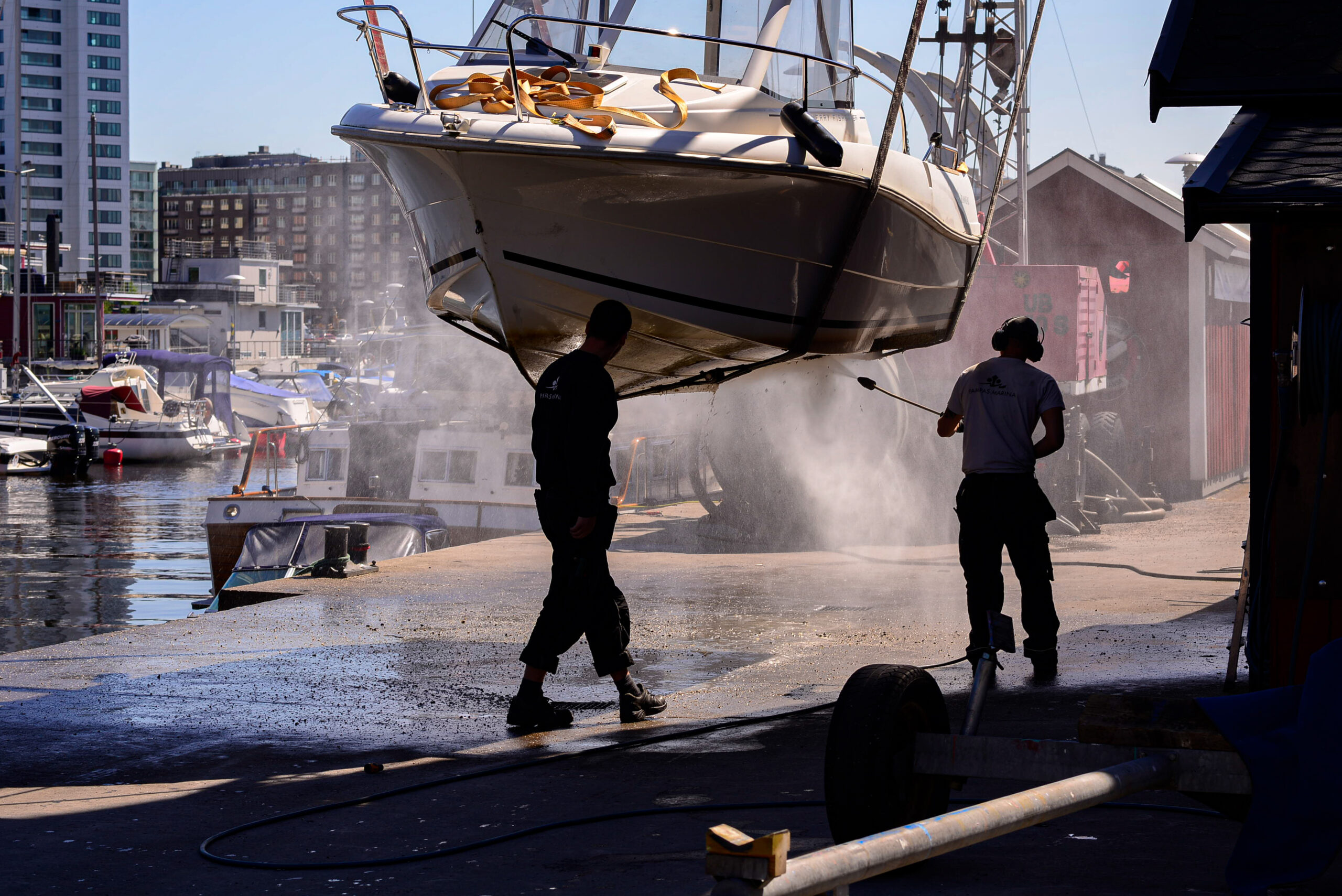 Two people washing a boat